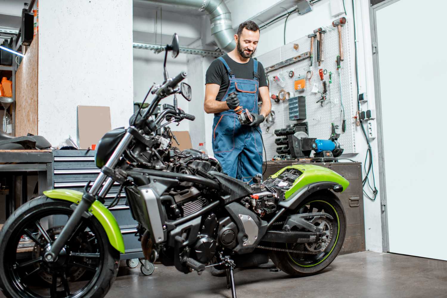 biker-with-motorcycle-in-the-garage-resize.jpg