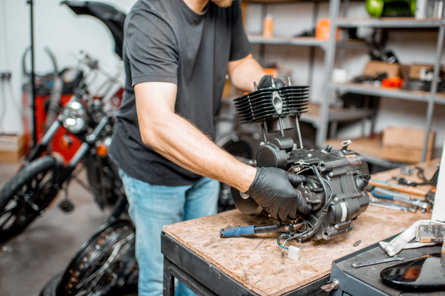 man-repairing-motorcycle-engine-resize.jpg